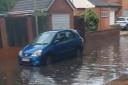 A road in Bury St Edmunds has become flooded after heavy rainfall