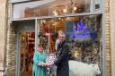 Town Mayor Peter Thompson presenting the shield for the best festive shop window to Romy Abraham from LOFT & SPIRES