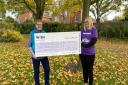 Donna Hazell with her mother Sue with the cheque for the Macmillan Unit at West Suffolk Hospital