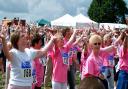 Thousands limbering up before taking part in a previous Race for life at Chantry Park in Ipswich
