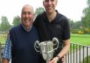 Four-handicap Darren Elliott (right) accepts the Eastern Counties Cup from Woodbridge captain Richard Barton who won this trophy before the new holder was born. Photograph: TONY GARNETT