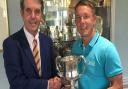 Danny Western of Gorleston receives the Seaton Robson Trophy from Aldeburgh vice-captain Antony Dearden. Western did the double winning both the gross and handicap competitions. Picture: CONTRIBUTED