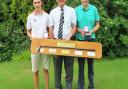 Louis Martin (left), the 17-year-old Suffolk match play champion with SGU president Colin Firmin and runner-up Luke Thompson. They are holding the Presidents Mashie which will find a place of honour for a year at Haverhill Golf Club. Photograph: