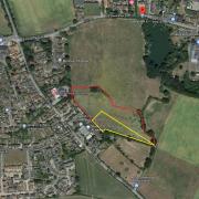 Land south of Old Stowmarket Road in Woolpit where plans for 40 homes have been lodged. The red line shows the development site with the yellow section the proposed school extension area.