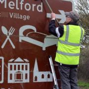 Road signs in Long Melford were cleaned by volunteers recently. Picture: JOHN NUNN