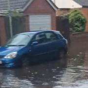 A road in Bury St Edmunds has become flooded after heavy rainfall