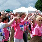 Thousands limbering up before taking part in a previous Race for life at Chantry Park in Ipswich