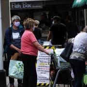 Woodbridge shoppers wear their masks in public, as it is now compulsory to wear a mask in shops