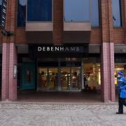 A passerby walks past Debenhams in Ipswich. The chain is closing all its stores putting 12,000 jobs at risk.