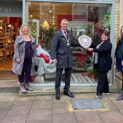 Loft & Spires has won the annual best-dressed Christmas window competition in Bury St Edmunds. Left to right: Jane Patton (winner of a £100 Bury St Edmunds Gift Card who voted for Loft & Spires), Our Bury St Edmunds vice chairman Maria Broadbent, Mayor