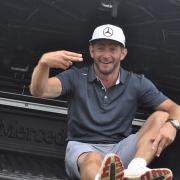 Lee Dinmore sits in the boot of his newly-won £50,000 Mercedes truck. Picture: CONTRIBUTED