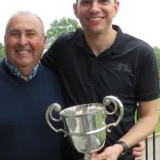 Four-handicap Darren Elliott (right) accepts the Eastern Counties Cup from Woodbridge captain Richard Barton who won this trophy before the new holder was born. Photograph: TONY GARNETT