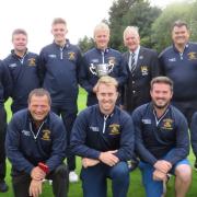 Bury St Edmunds' Hambro winners: Back (from left): Trevor Titcombe, Mike Greener, Dan Smailes, Phil Smailes (team captain, with trophy), SGU president Colin Firmin, Steve Lankester and Malcolm Wyer. Front: Max Adams, Roger Nicholson, Craig Nurse, Ben