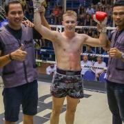 Joe Le Maire celebrates his latest victory in Thailand with the Sumalee Boxing Gym team. Picture: MR LEAF PHOTOGRAPHY