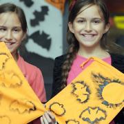 Halloween fun at Bury Library making trick or treat bags. Constance Tamblyn (right) and Amelia Tamlyn