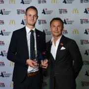 George Byrne (left) receives his Match Official of the Year award from former Chelsea and England midfielder Dennis Wise. Picture: SUFFOLK FA
