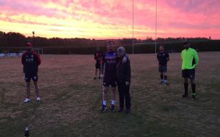 The sun came up over the club as the relay ended. Pictured in the middle is First team captain Ed Ballam with his mum, an NHS worker Picture: THURSTON RUGBY CLUB